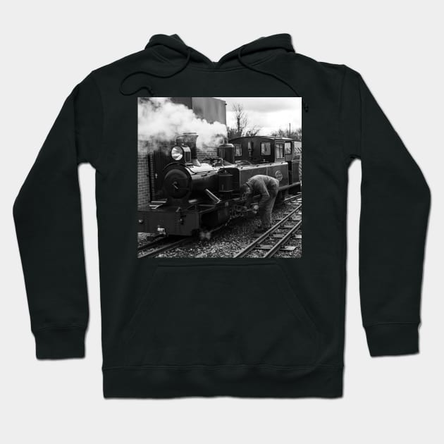 Engineer attending to a steam train on the Bure Valley Railway Hoodie by yackers1